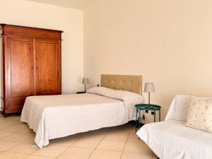 Postel nebo postele na pokoji v ubytování Residence Montefiore