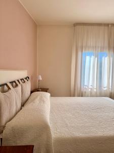 Postel nebo postele na pokoji v ubytování Residence Montefiore