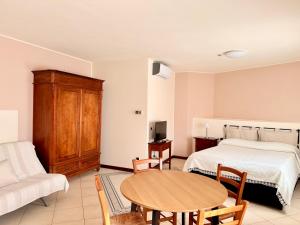 Postel nebo postele na pokoji v ubytování Residence Montefiore
