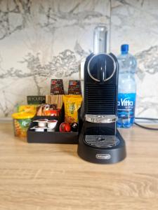 a black blender sitting on top of a table at Casiana Apartments in Timişoara