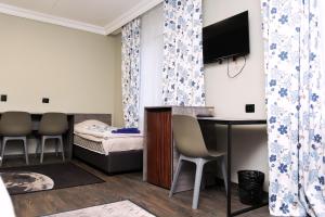 TV a/nebo společenská místnost v ubytování Hotel Tahar