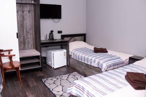 Postel nebo postele na pokoji v ubytování Hotel Tahar