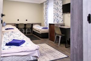 Postel nebo postele na pokoji v ubytování Hotel Tahar