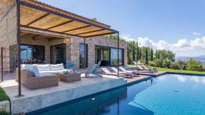 a villa with a swimming pool and a house at CASALE THE PLACE 6&2, Emma Villas in Petroro