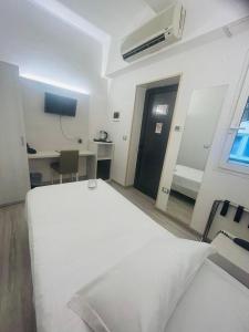 A bed or beds in a room at Hotel Giardinetto Al Sant'Orsola