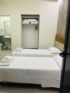 A bed or beds in a room at Hotel Giardinetto Al Sant'Orsola