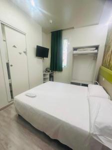 A bed or beds in a room at Hotel Giardinetto Al Sant'Orsola