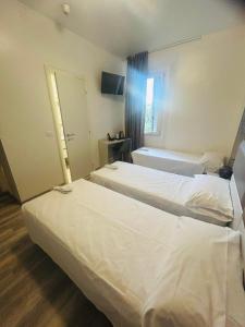 A bed or beds in a room at Hotel Giardinetto Al Sant'Orsola