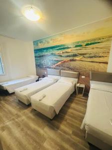 A bed or beds in a room at Hotel Giardinetto Al Sant'Orsola