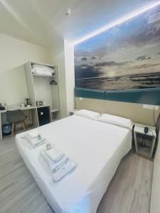 A bed or beds in a room at Hotel Giardinetto Al Sant'Orsola