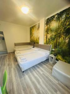 A bed or beds in a room at Hotel Giardinetto Al Sant'Orsola
