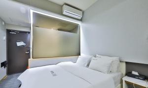 Postel nebo postele na pokoji v ubytování Hotel TAO