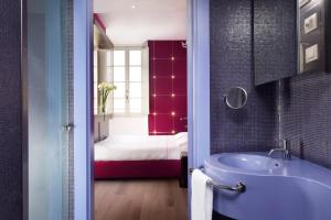 Postel nebo postele na pokoji v ubytování UNA HOTELS Vittoria Firenze