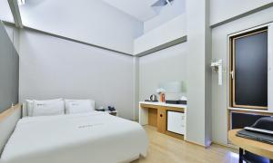 Voodi või voodid majutusasutuse Hotel TAO toas