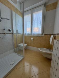 a bathroom with a shower and a toilet and a sink at B&B La terrazza in Ozzano dell Emilia