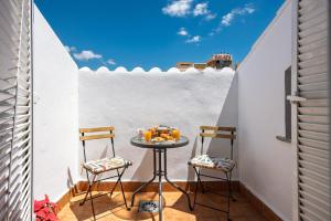 A balcony or terrace at WonderStays Apartamentos Maribel