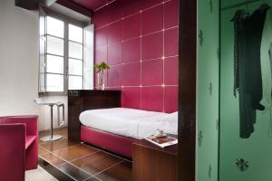 Postel nebo postele na pokoji v ubytování UNA HOTELS Vittoria Firenze