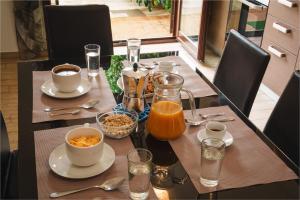 a table with food and drinks on top of it at Villa Giusi in Tropea