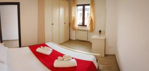 a bedroom with a bed with towels on it at Villa Giusi in Tropea