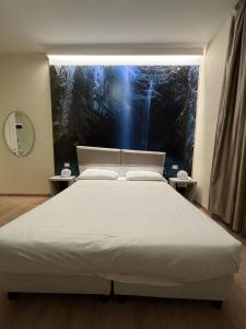 A bed or beds in a room at Hotel Giardinetto Al Sant'Orsola