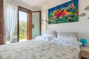 Ένα ή περισσότερα κρεβάτια σε δωμάτιο στο Villa L'ulivo