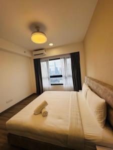 Postel nebo postele na pokoji v ubytování Agile TRX Luxury suite Bukit bintang