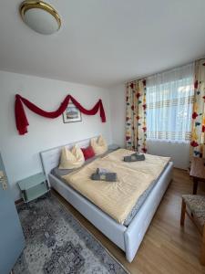 Postel nebo postele na pokoji v ubytování Guesthouse-Mother