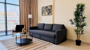 a living room with a couch and a table at Luxurious apartments at JLT by Checkmyguest in Dubai