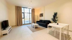 a living room with a couch and a table at Luxurious apartments at JLT by Checkmyguest in Dubai