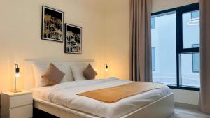 a bedroom with a bed and a large window at Luxurious apartments at JLT by Checkmyguest in Dubai