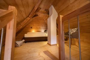 Postel nebo postele na pokoji v ubytování Schwarzwald Chalet -Wilde Rench-