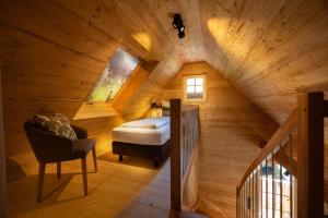 Postel nebo postele na pokoji v ubytování Schwarzwald Chalet -Wilde Rench-