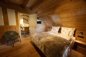 Postel nebo postele na pokoji v ubytování Schwarzwald Chalet -Wilde Rench-