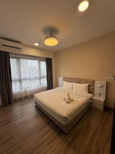 Postel nebo postele na pokoji v ubytování Agile TRX Luxury suite Bukit bintang