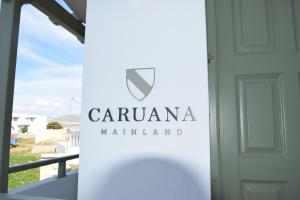 a sign that reads caruana maliant in front of a door at Caruana Living in Agia Anna Naxos
