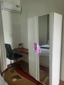 a room with a desk and a chair and a bedroom at Bieni Homes in Nkunjila