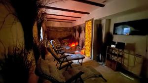 a living room with a couch and a fireplace at Hotel Kryształ in Świeradów-Zdrój