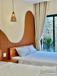 Katil atau katil-katil dalam bilik di Làng Chài Homestay Phan Thiết +36 gambar