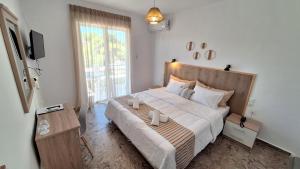 Posteľ alebo postele v izbe v ubytovaní Evita's Resort + 37 fotografií