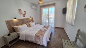 Photo de la galerie de l'établissement Evita's Resort, à Poros