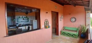 a shop with a window and a bench in a room at Flat Casa Taíba 2003 in Taíba