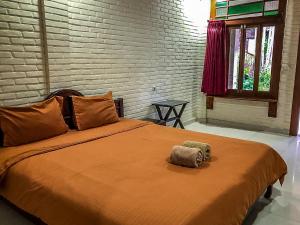 Katil atau katil-katil dalam bilik di Arys Garden Hotel Yogyakarta