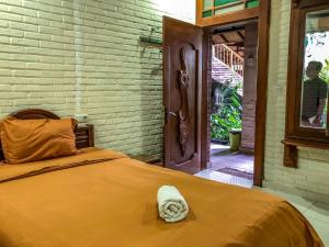 Katil atau katil-katil dalam bilik di Arys Garden Hotel Yogyakarta