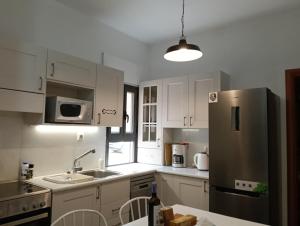 A kitchen or kitchenette at Trochalo Villas
