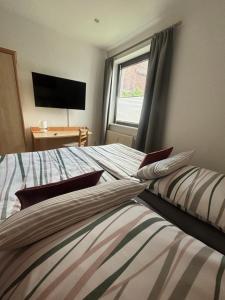 Postel nebo postele na pokoji v ubytování Ferienwohnung Alte Volksbank Nauendorf