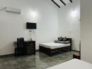 Postel nebo postele na pokoji v ubytování J&J resort