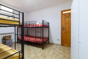 A bed or beds in a room at Casa vacanze Patrizia