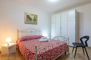 A bed or beds in a room at Casa vacanze Patrizia