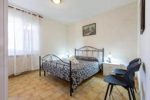 A bed or beds in a room at Casa vacanze Patrizia