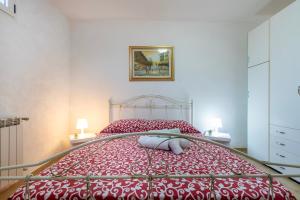 A bed or beds in a room at Casa vacanze Patrizia